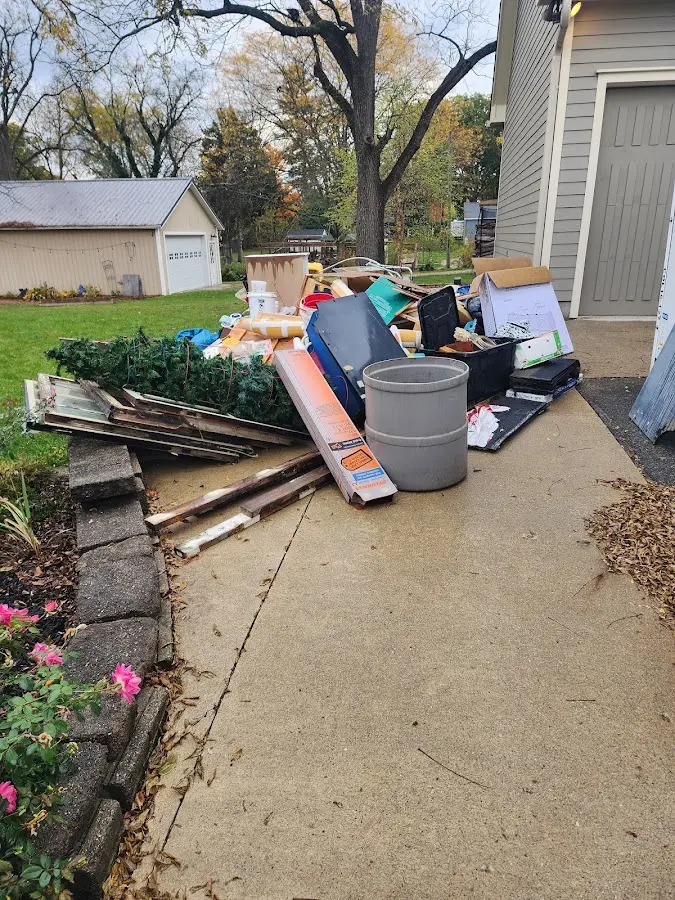 Dumpster being loaded with debris for Demolition Dumpster Rental in White Center